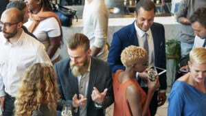 Top view of a variety of people talking to each other in casual business attire.